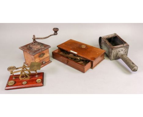 A set of brass beam scales, the mahogany base with drawer and labelled 'De Grave Short &amp; Co Ltd makers', 28.5cm wide with
