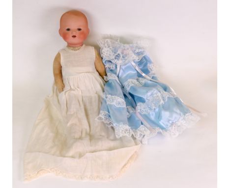 An Armand Marseille bisque headed doll, with sleeping eyes and open mouth, stuffed body, 39cm high.