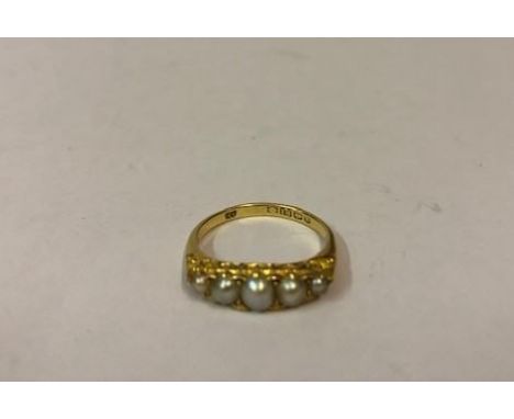 A Ladies 18ct Gold Pearl Ring, Set with five graduated pearls, stamped 18, hallmarks for Birmingham, overall weight 4.1 grams
