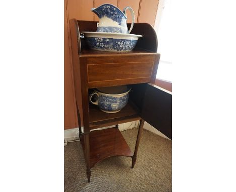 A Mahogany Washstand, circa 19th century, Having a fitted open top above a door, enclosing four pieces of  Spode style toilet