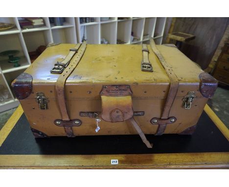 A Vintage Travel Trunk, Having brass and leather fittings, with a hinged top enclosing a canvas lined interior, 33cm high, 85