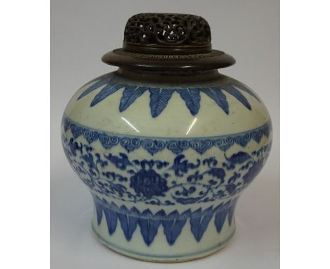 A Chinese Kangxi Style Blue and White Pottery Vase, Having a reticulated hardwood cover, Decorated with allover floral and le