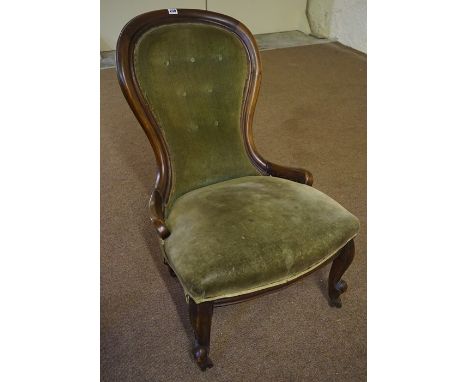 A Victorian Ladies Mahogany Parlour Chair, Having a spoon back rest, upholstered in later green button back velour, raised on