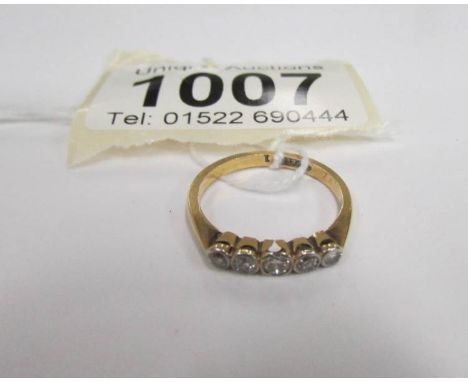 An 18 carat gold 5 stone diamond ring, size K