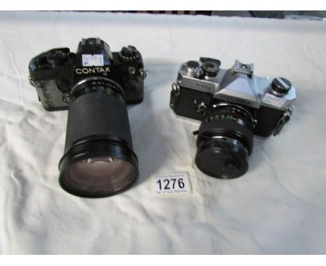 A Fijica ST705W camera with Fujinon 55 mm lens and a Contax 139 camera with Tamaron 35-135mm lens