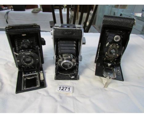 An Eastman Kodak No.2 folding autographic Brown camera, an Ensign 220 Selfix camera and a Houghton's Kuto popular camera