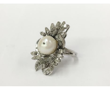 A large 14 carat white gold diamond and pearl ring, size I half