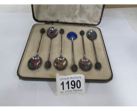 A cased set of 6 silver and enamel coffee spoons