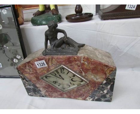 A French marble mantel clock surmounted figure, in working order