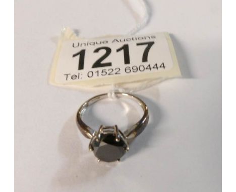 A 9ct gold tine set black stone, HM Birmingham 2006, size M