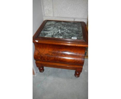 A mahogany commode