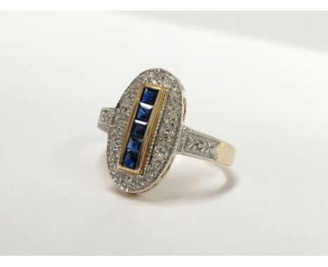 An oval yellow gold sapphire and diamond ring, size M