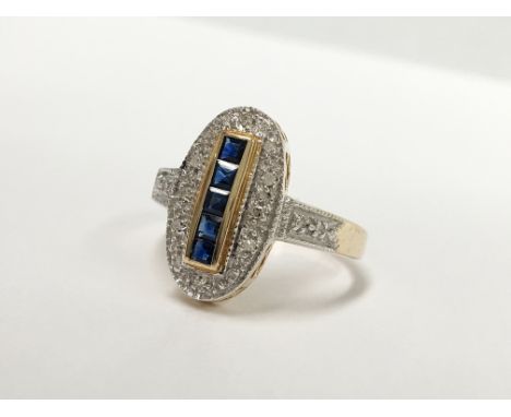 An oval yellow gold sapphire and diamond ring, size M