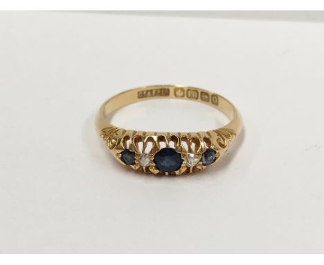 An 18ct gold diamond and sapphire ring, size O