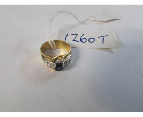 A 14ct gold ring with 15 small diamonds (1 missing) and a sapphire