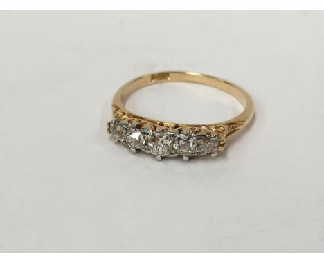 An 18ct gold ring set diamonds, stamped 18ct, size K