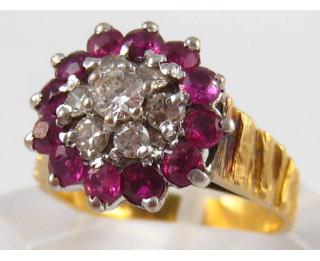 A yellow metal (tests 18 carat gold) ruby and diamond ring, estimated total diamond content approx 0.40 carat, ring size N, 5