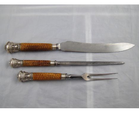 A three piece silver mounted stag horn carving set . Sheffield 1885. 