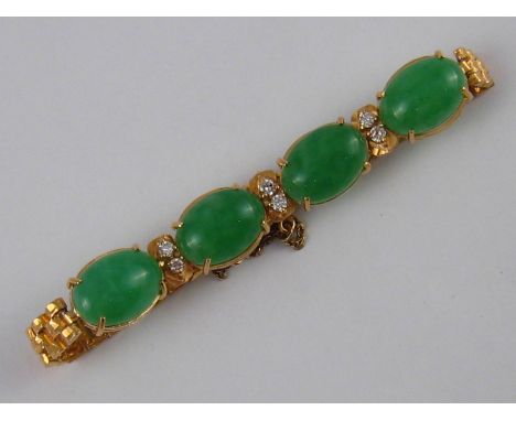 A yellow metal (tests 18 carat gold) cabochon jade and diamond bracelet, jades approx 14 x 10mm, bracelet approx 17cm long, 1