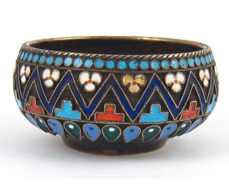 A Russian silver small salt with geometric cloisonne enamel. Marks for Pavel Ovchinnikov, Moscow 1895. 4.5cm. diameter, wt. 2