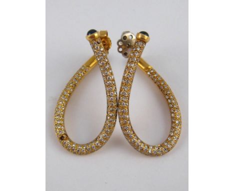 A pair of yellow metal (tests 18 carat gold) pave set diamond and sapphire earrings (one stone lacking), approx 33mm drop, 10