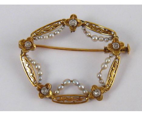 An antique 18 carat gold and seed pearl brooch with rose cut diamond accents, approx 33mm wide, 4 gms.
