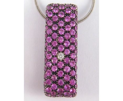 David Morris . An 18 carat white gold, pink sapphire and diamond pendant by David Morris, signed David Morris , approx 32 x 1