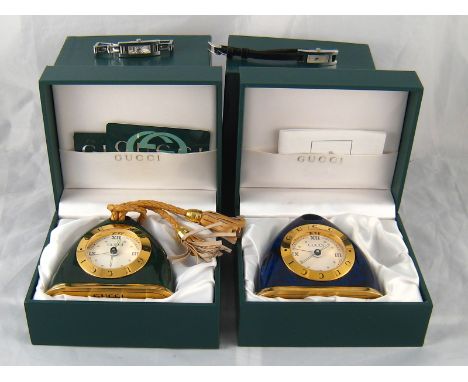 A mixed lot comprising a vintage lapis lazuli effect lacquer travel alarm clock by Gucci, approx 9cm high, in Gucci case, a s