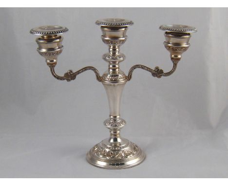 A silver three light candelabrum, 26cm. across. Birmingham, 1976.