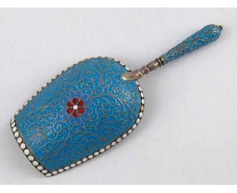 A Russian cloisonne enamelled silver caddy spoon with gilt lined bowl, S K (Cyrillics) Wt.35gm. Moscow 1891.