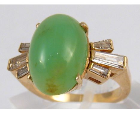 A yellow metal (tests 14 carat gold) cabochon jade and baguette diamond ring, jade approx 15 x 10mm, ring size M, 6.1 gms.
