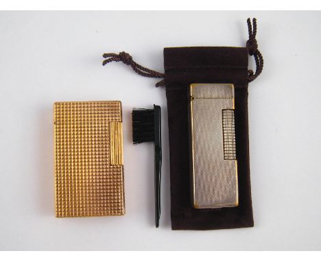 A mixed lot comprising a Dunhill silver plated cigarette lighter in Dunhill pouch, together with a gold plated S.J. Dupont li
