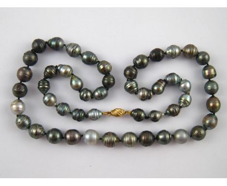 A grey Tahitian cultured pearl necklace with a yellow metal (tests 18 carat gold) clasp, largest pearls approx 13mm, necklace