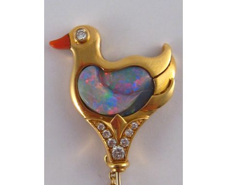 A fine 18 carat gold brooch designed as a duck with an opal body and coral beak, enhanced with diamonds, the stones of fine c