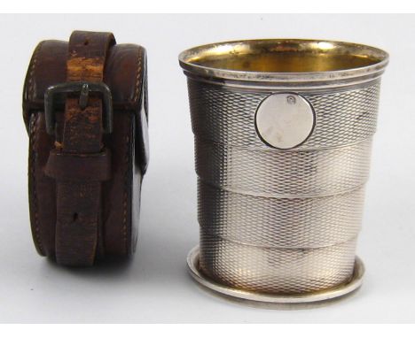 A Victorian campaign collapsible four section engine turned silver beaker in leather carrying case by John Harris, London, 18