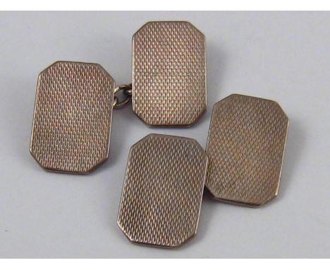 A pair of silver cufflinks with engine turned decoration, hallmarked London 1953, 7.9 gms.