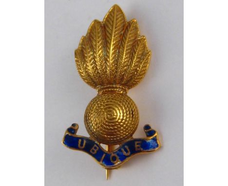 A 9 carat gold and enamel Royal Artillery brooch by Garrard & Co, approx 3cm, 4.4 gms, in Garrard box.
