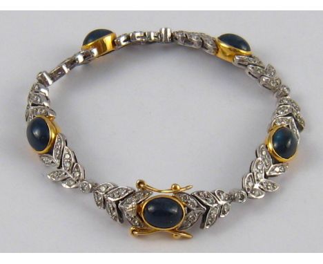 A yellow and white metal (tests 18 carat gold) sapphire and diamond bracelet, the cabochon sapphires measuring approx 8.5 x 6