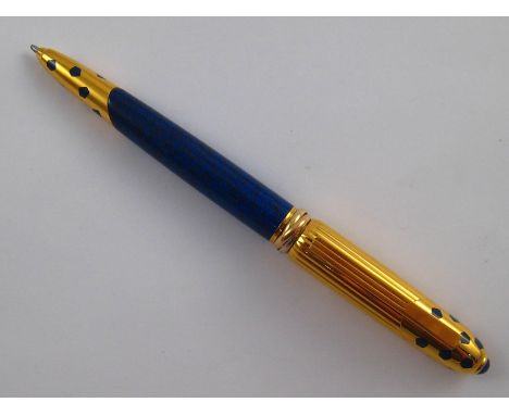 A Panthere De Cartier ballpoint pen, numbered 017084, Made in France, circa 1990.