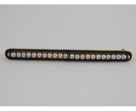A yellow metal (tests 18 carat gold) blue enamel and seed pearl brooch, unascribed continental marks, approx 5.5cm long, 4.9 