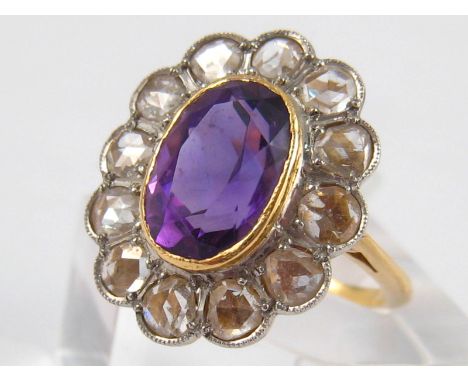 A yellow metal (tests 18 carat gold) amethyst and rose cut diamond ring, the amethyst measuring approx 10.5 x 7mm, ring size 