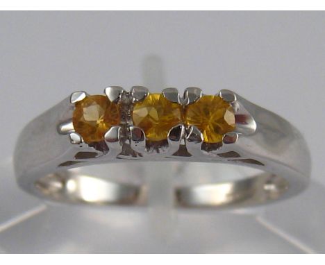 A 9 carat white gold yellow sapphire ring, size N, 2.6 gms
