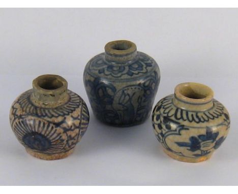 Three antique ceramic unguent or ink pots with restorations. 