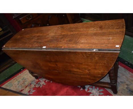 A 19th century oak gateleg dining table, bobbin turned supports, rectangular stretchers, opens to 166cm