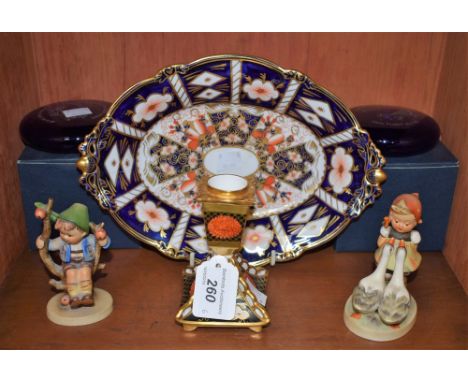 An Abbeydale Chrysanthemum pattern short candlestick; a Goebel Hummel figure, young girl with geese; another of a young boy; 