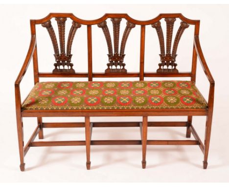 A Hepplewhite design mahogany chair-back sofa, Prince of Wales feather splats, downswept arms, drop in seat, tapered square l