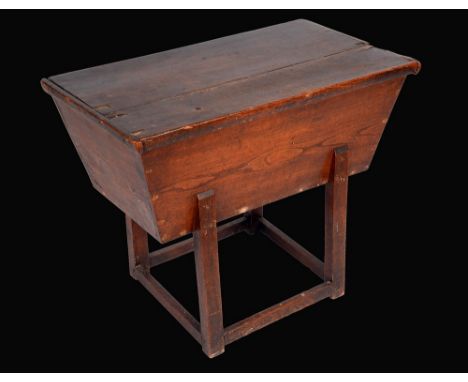A 19th century elm dough trough, lift-off cover, joined underframe, 65cm high, 82cm wide 