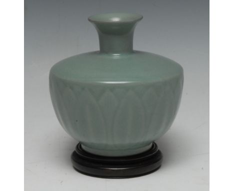 A Chinese Longquan celadon ovoid lotus vase, moulded in relief with a frieze of stepped leaves, lightly crackled ground in th