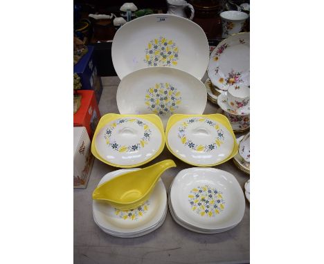 A mid 20th century Midwinter Modern Fashion Shape dinner service, for six, comprising dinner tea and side plates, serving pla