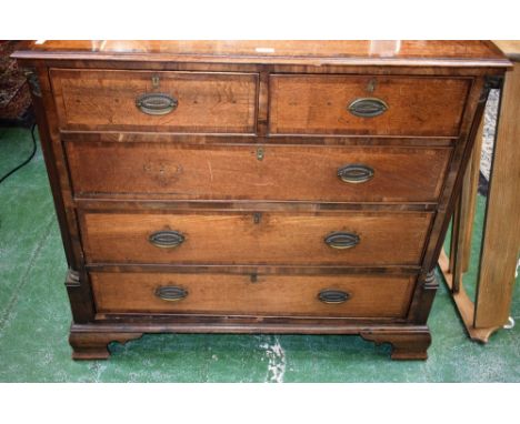 A 19th century oak chest, well figured crossbanded rectangular top above two short and three long drawers, flanked by reeded 